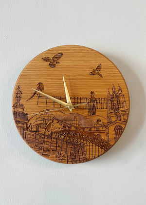 Handmade solid oak laser engraved clock. Featuring landmarks such as St James' Park, Greys Monument, The Glasshouse, Newcastle Cathedral, The Tyne Bridge, Angel of the North and Newcastle Cathedral. 