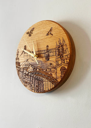 Side view of handmade solid oak laser engraved clock. Featuring landmarks such as St James' Park, Greys Monument, The Glasshouse, Newcastle Cathedral, The Tyne Bridge, Angel of the North and Newcastle Cathedral. 